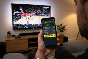 Smartphone-Bildschirm mit einer angebotenen Cashout-Summe während eines laufenden EuroLeague-Spiels